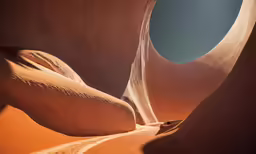 a view of the dunes and sand from within a small window