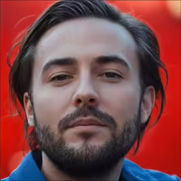the man has long hair and a beard with a mustache