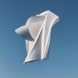 a building with a sculpture in front of a blue sky