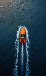 a boat with two people inside is moving on the water
