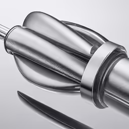 a metal object is shown with a handle and toothbrush