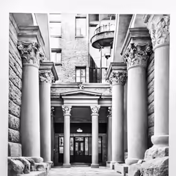 an old building with columns in front