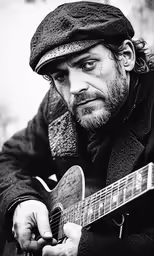 a man is holding an acoustic guitar with a hat on