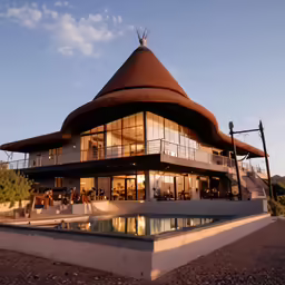 the very modern home is set on an hilltop