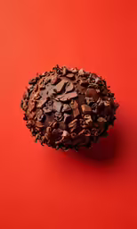 there is an uncooked piece of cake on a red surface