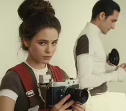 two people with cameras on either side of them
