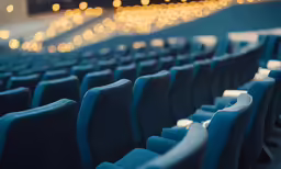 the seating in an empty auditorium is blue