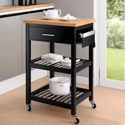 a kitchen cart with a wooden top and drawers