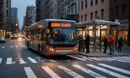 a commuter bus waiting at the curb outside of the station