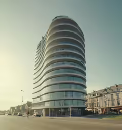 a curved building is sitting on the side of the road
