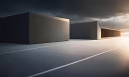 three gray concrete structures on top of a road