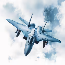 fighter jet flying under cloudy skies on blue and white day