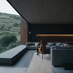 a person is sitting on a couch in a living room