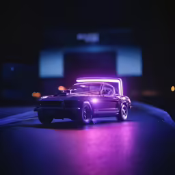 car in the dark driving under neon lights