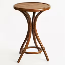 a small round wooden table with an iron base and circular legs