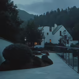 a couple of houses that are by the woods