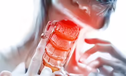 a beautiful young lady in a lab coat holding a comb
