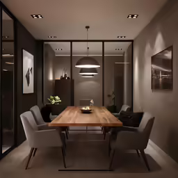 a room with grey walls and chairs, a large wood table and lights