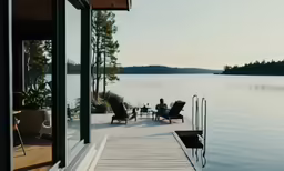 a lake with people sitting at a pier