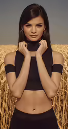 a model is posing in the middle of a wheat field