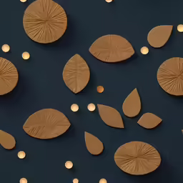 brown leaves and white lights are on a black surface