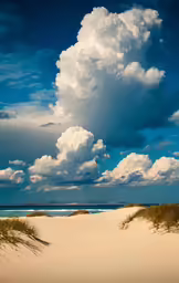 the clouds are very dramatic in the sky over the sand dunes