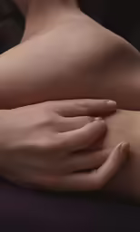 the hands of a woman with very small bumps on her upper half