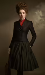 a woman is wearing a black dress and a red necktie