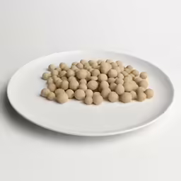 a plate topped with small wooden balls