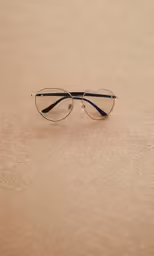 a pair of glasses resting on the ground