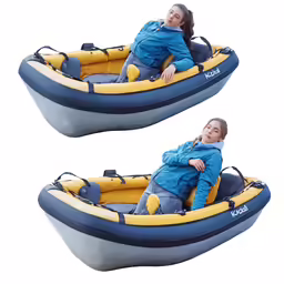 two people riding on a boat floating in the water