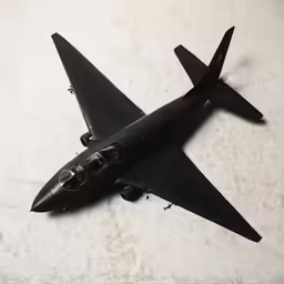 an airplane flies through the air on a marble surface