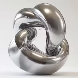 an artistic silver sculpture on white background