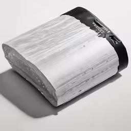 a piece of material with a black band on top of it