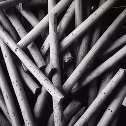 a bunch of sticks piled together in a container