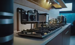 a large camera set up on top of a stove