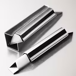 metal object on white surface laying next to other items