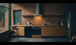 a kitchen with dark stone walls and wood cabinets