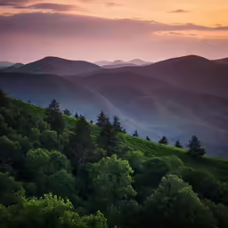 the sun is going down over the mountains