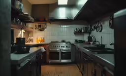 a kitchen filled with lots of shiny metal appliances