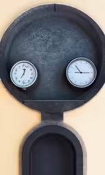 an image of a clock that has faces made out of scales