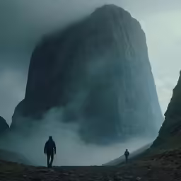 the mountain climbrs are standing in a foggy field