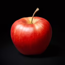 a red apple is shown on the black background