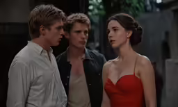 a young woman and a man standing together