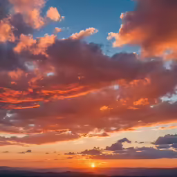 sunset, clouds in the sky, with an airplane on ground