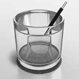 a glass container with a black pen in the inside