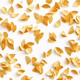 a close up shot of golden metal chips