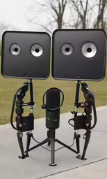 the speakers on each side of the stand are facing different directions