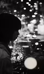 a child looking at candles on a table