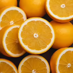 a pile of oranges sitting on top of each other